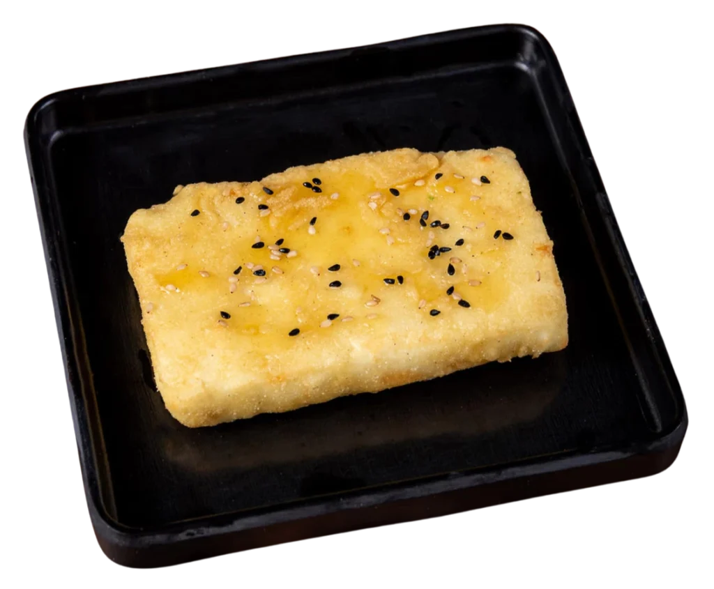 Feta cheese saganaki with honey and sesame seeds