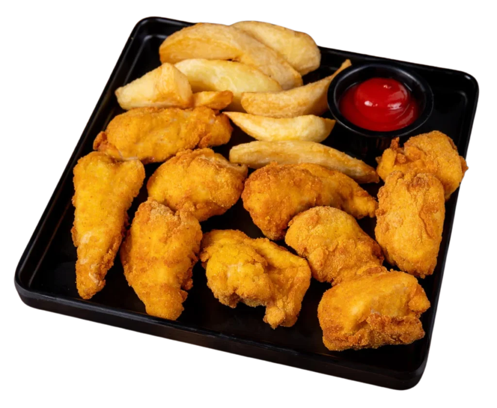 Chicken nuggets served with fries and ketchup